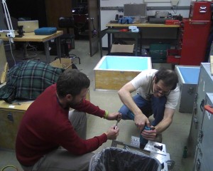 Robert Michell (SwRI) and Don Hampton (UAF GI) assembling imagers and enclosures for the Venetie, AK site.